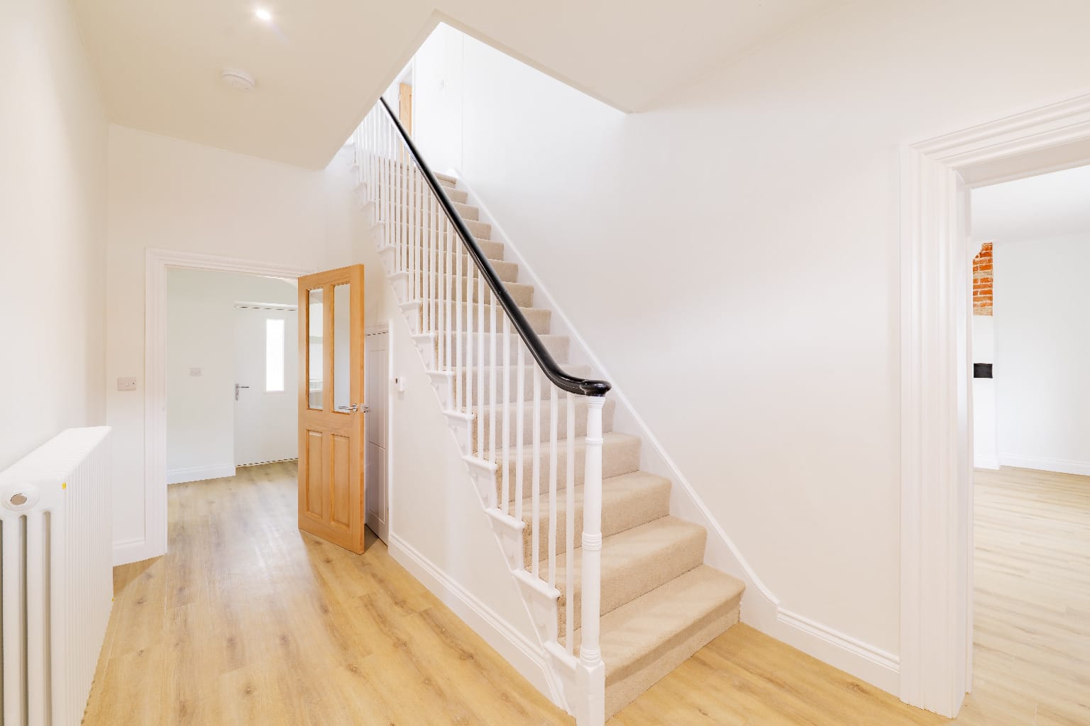 Painted staircase newel post and hallway, new build